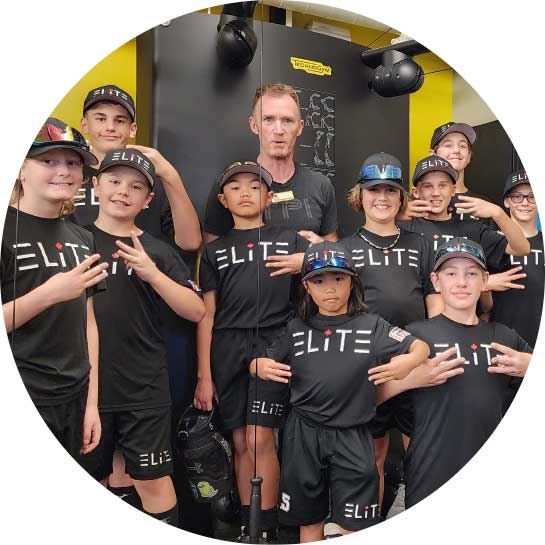 Kids baseball team posing in workout gym
